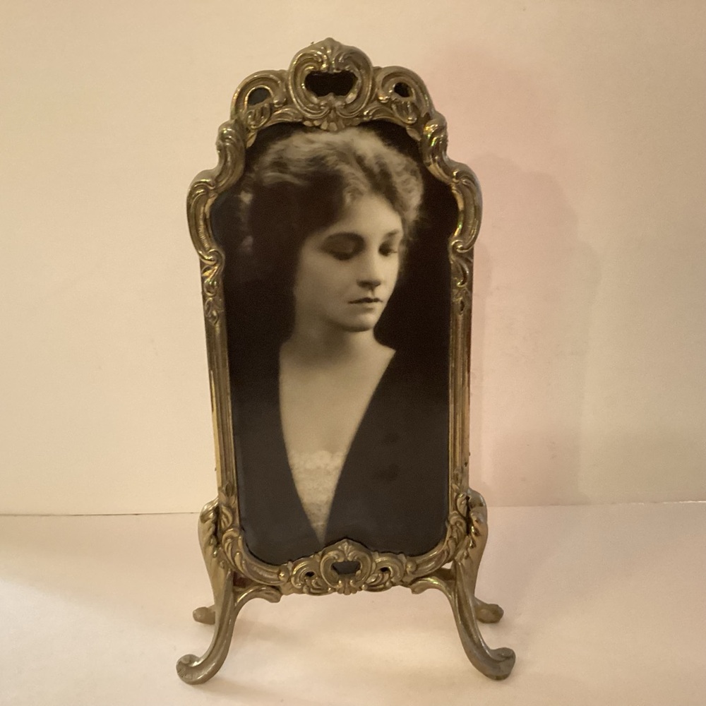 Antique brass picture frame, opening measures 8 1/2” x 4”